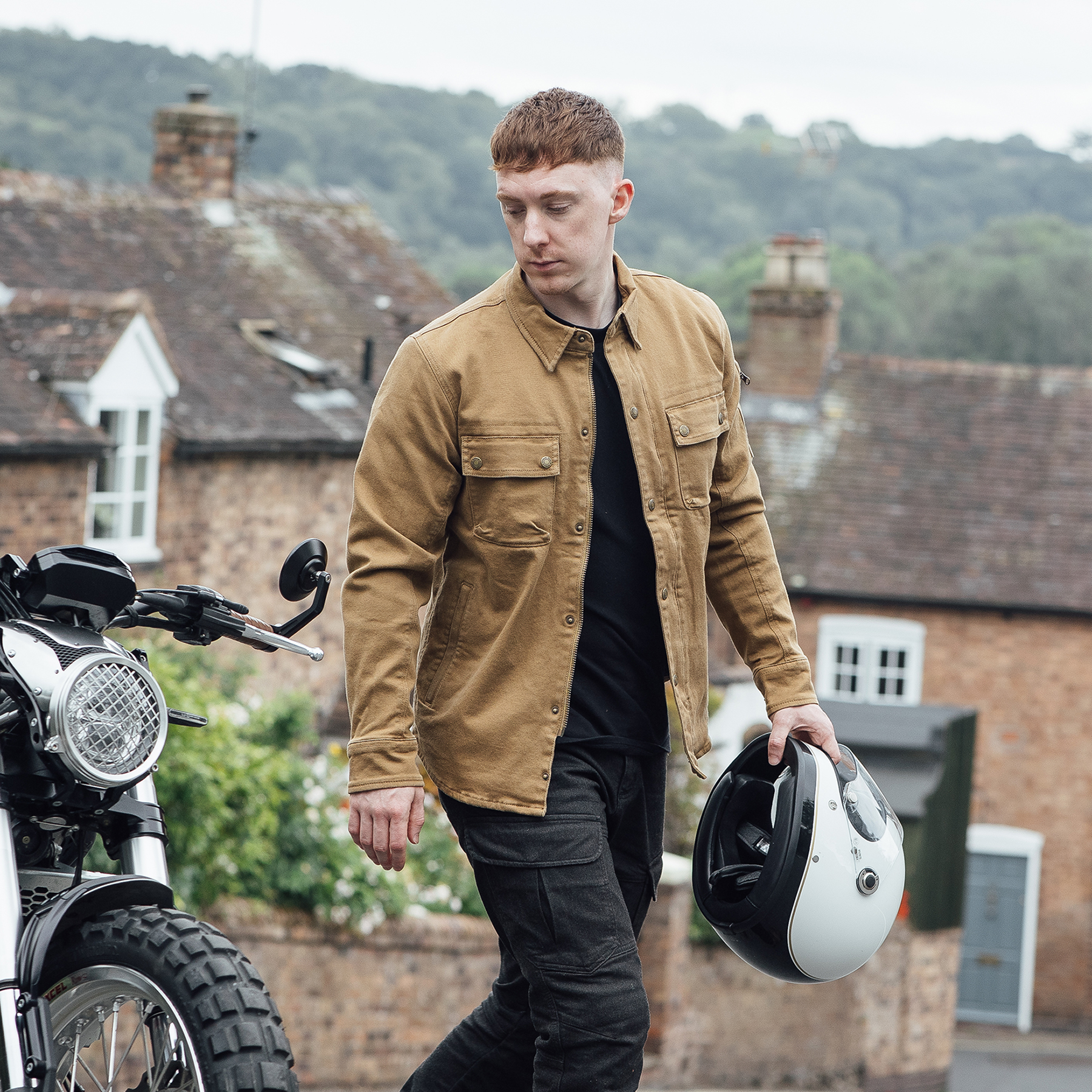 Lifestyle image of the Merlin Brody shirt in colour camel